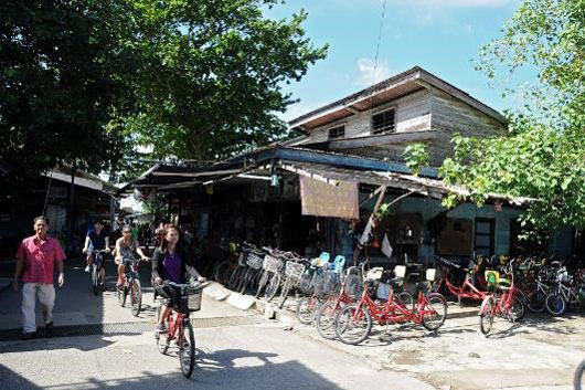 Visitors cycling on Pulau Ubin.